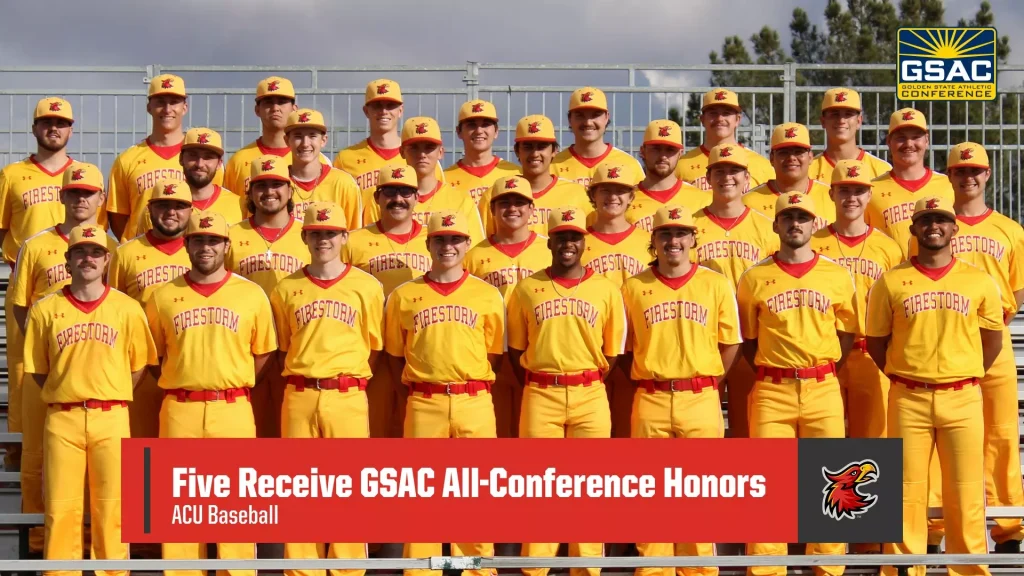Group photo of the Firestorm baseball team in yellow uniforms posing on bleachers with the GSAC logo visible in the top-right corner.