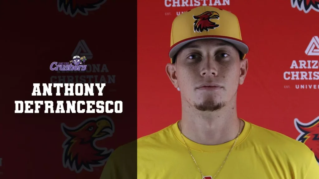 Portrait of Anthony DeFrancesco in a yellow Crushers jersey, red backdrop with team logos, and his name on the left side.