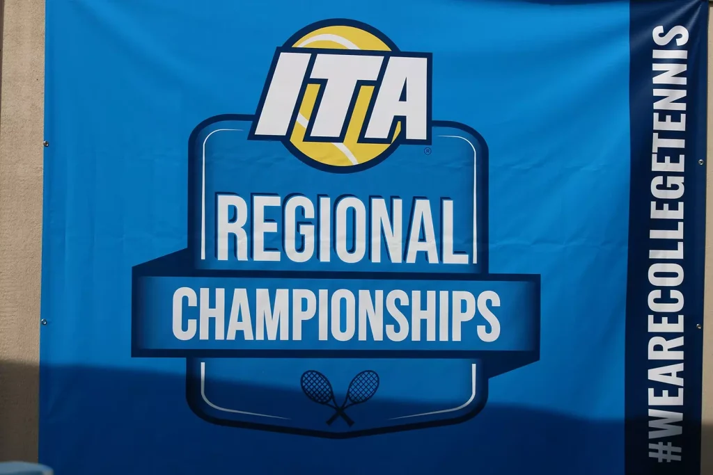 Blue ITA Regional Championships banner with logo, large 'REGIONAL CHAMPIONSHIPS' text and crossed tennis rackets icon in the center.