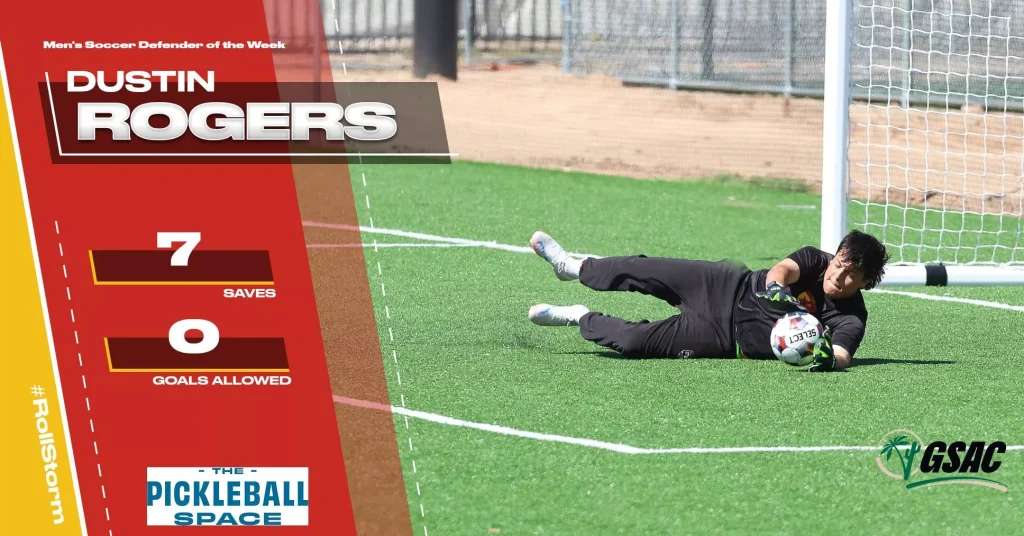Soccer goalie diving to save a ball on a turf field, overlaid with bold red/yellow graphics and text about saves and goals allowed (7 saves, 0 goals).