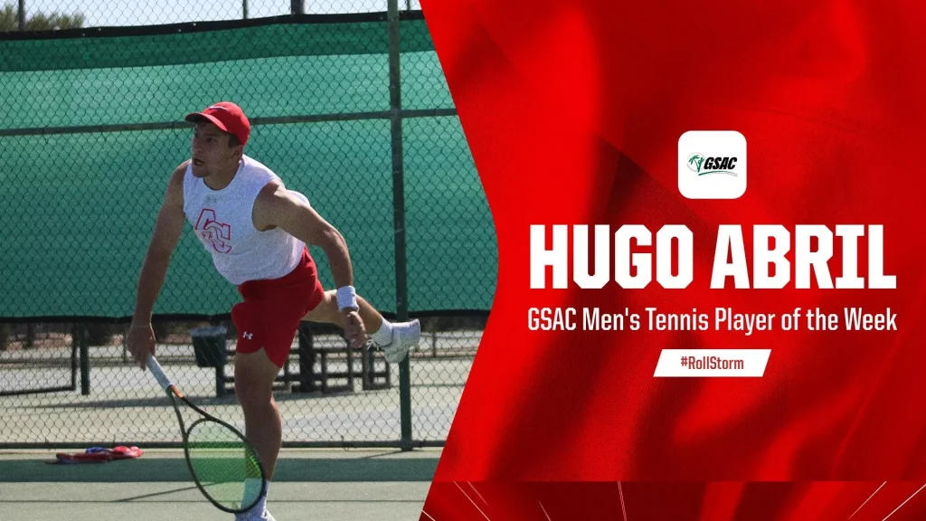Tennis player in white tank top and red shorts on a court, with a bold red banner announcing Hugo Abril as GSAC Men's Tennis Player of the Week.
